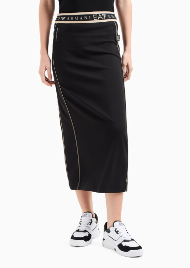 Спідниця міді Slim Fit: приталений силует, але не надто вузький.